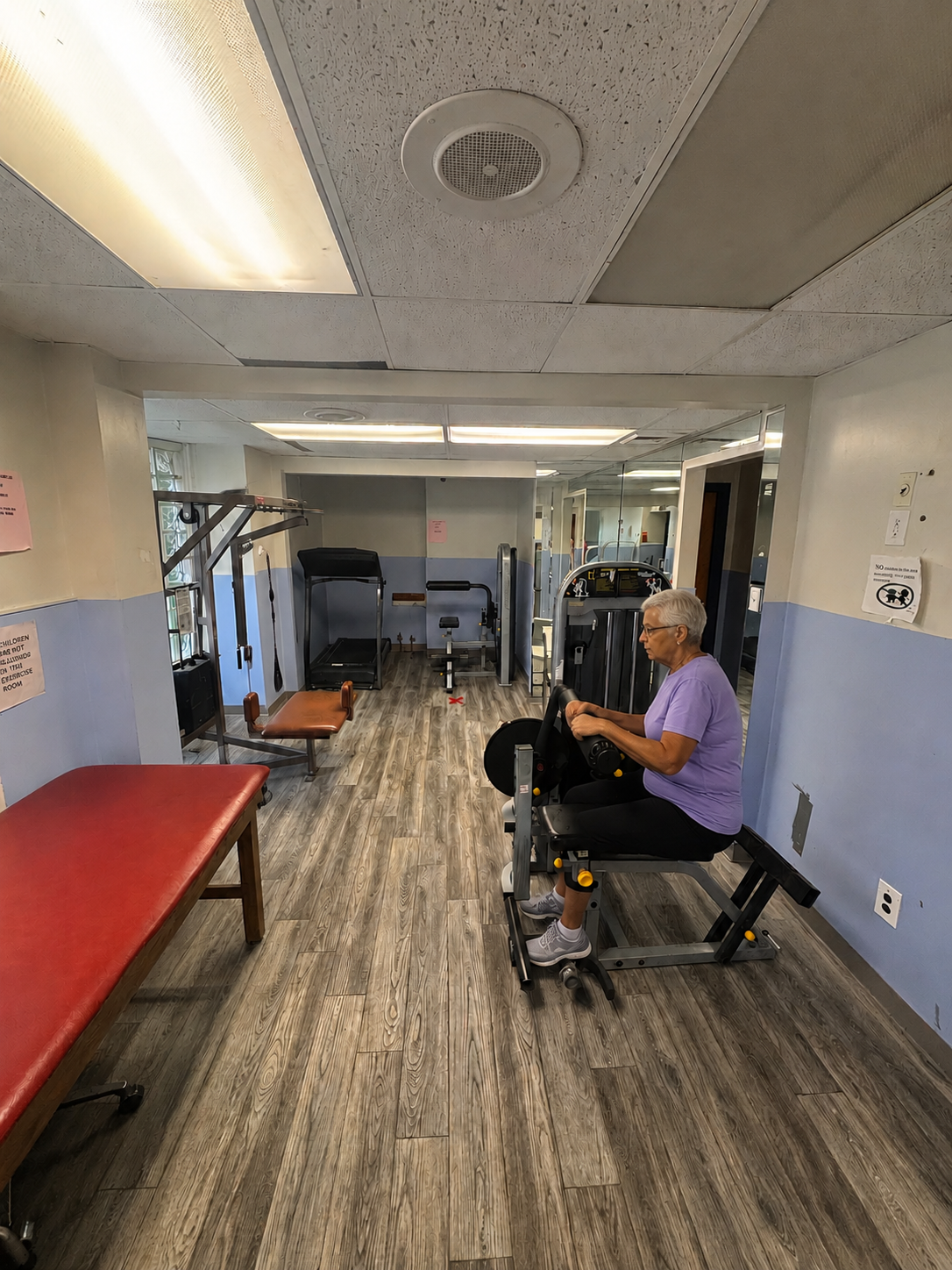 Physical therapy treatment tables and rehabilitation equipment at the Chew Avenue clinic